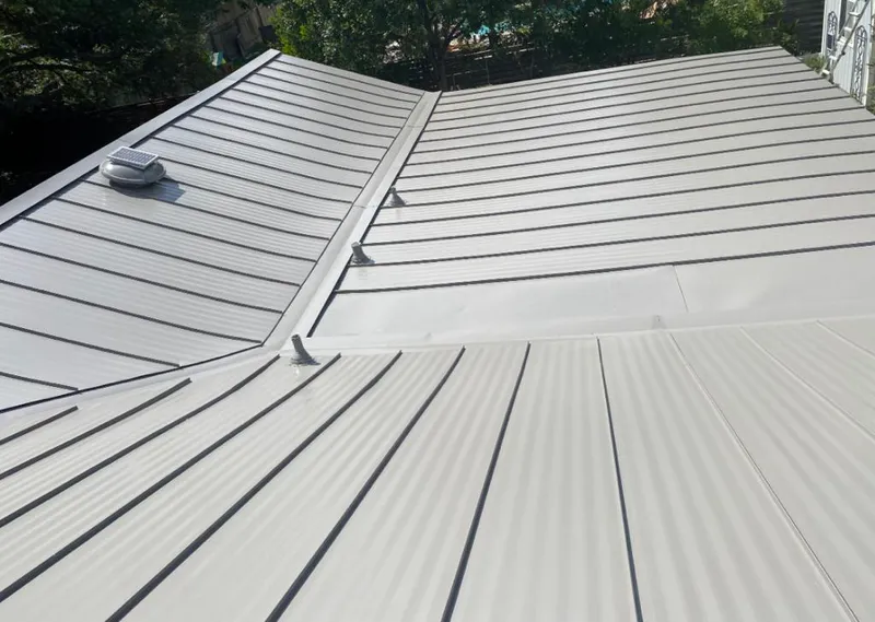 Solar attic fan installed on a metal roof for Roof Ventilation in South Venice